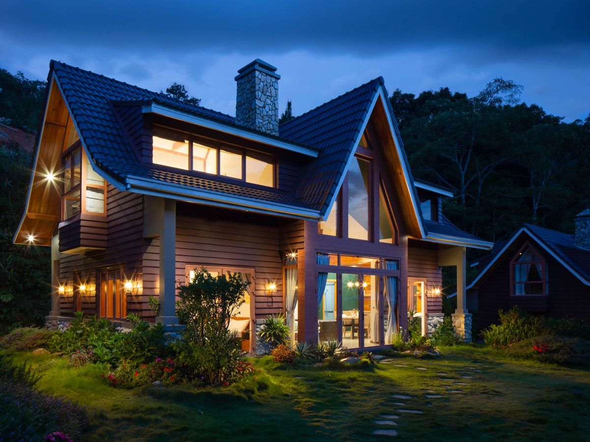 A warmly lit family home at dusk